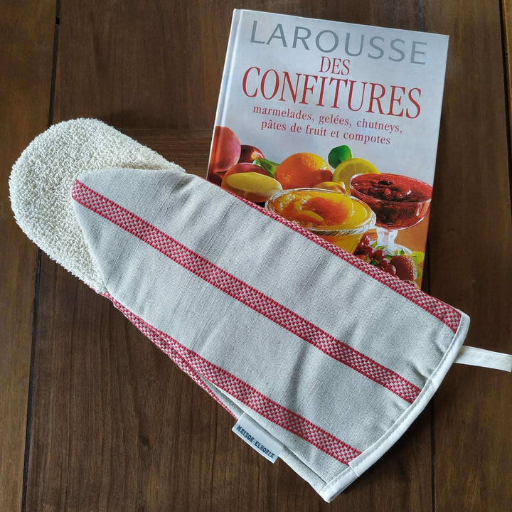 Gauntlet long oven glove linen union with red stripes on a cooking recipe book