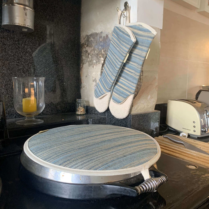One Aga hob lid cover blue striped on an Aga range cooker with a matching pair of gauntlets oven mitts