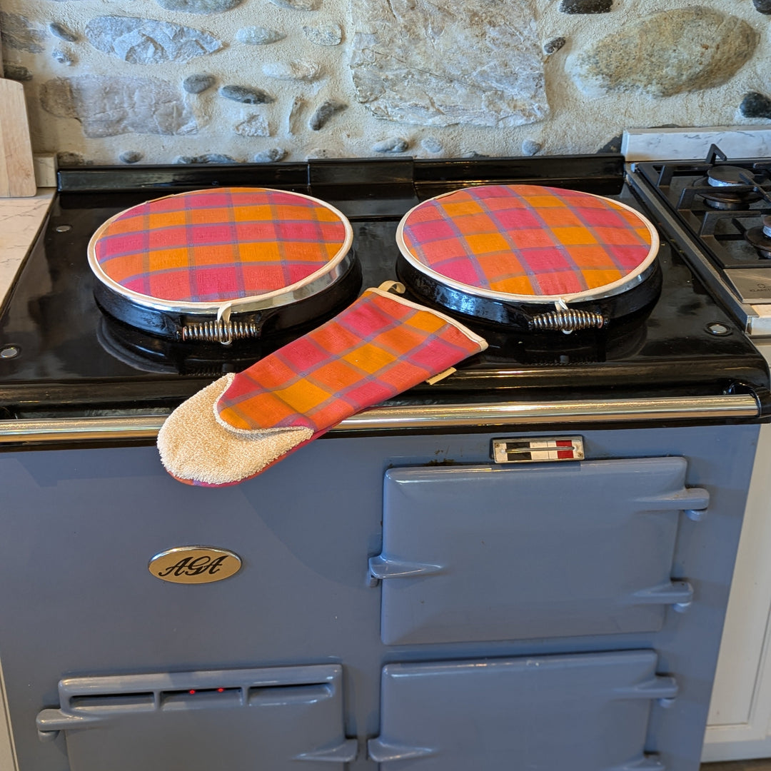 Hob Cover orange pink blue with matching long oven glove on a blue Aga range cooker 