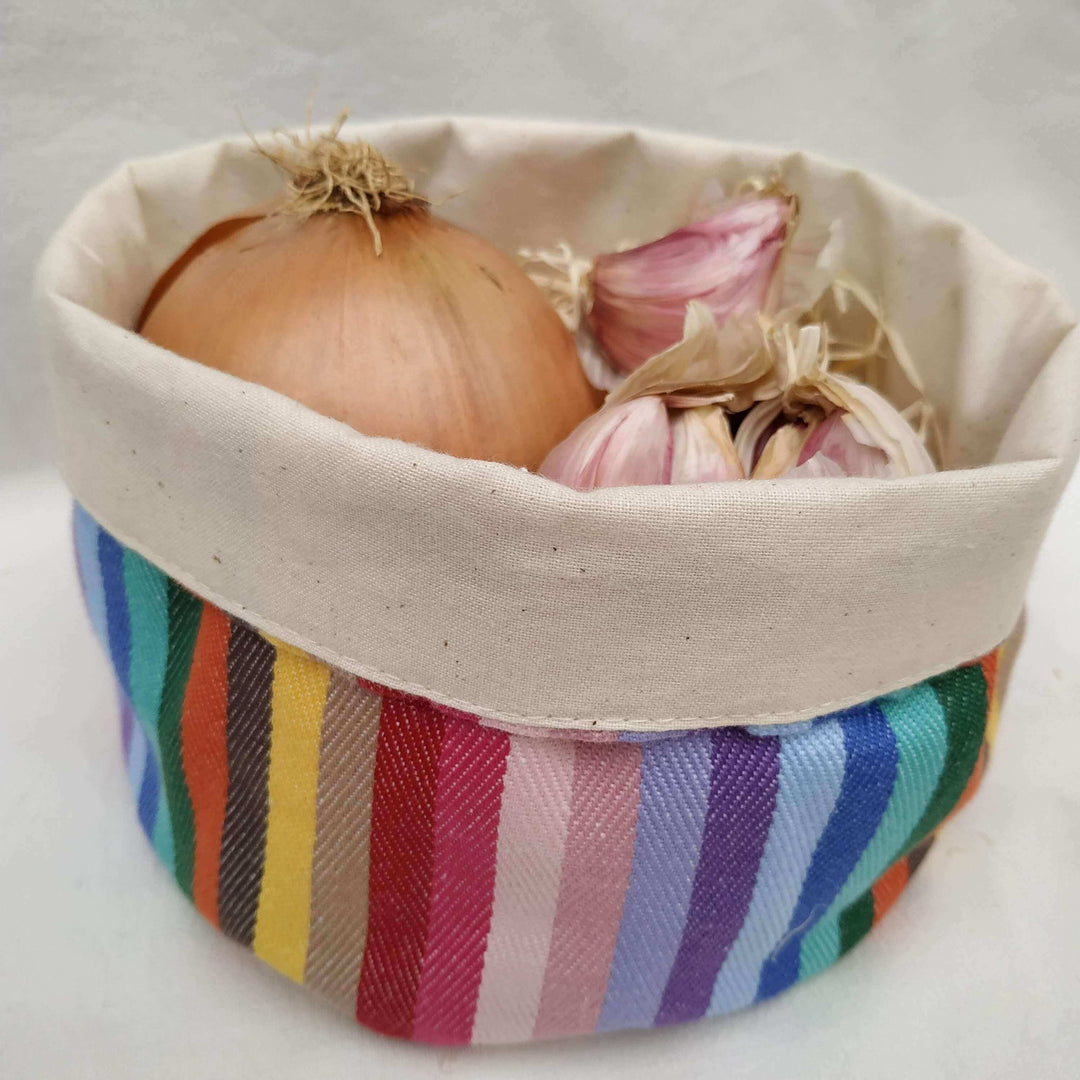 rainbow cotton round storage pot bag close up holding onions