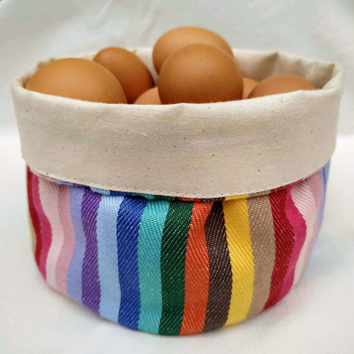 rainbow cotton storage bread bag on a table set holding eggs