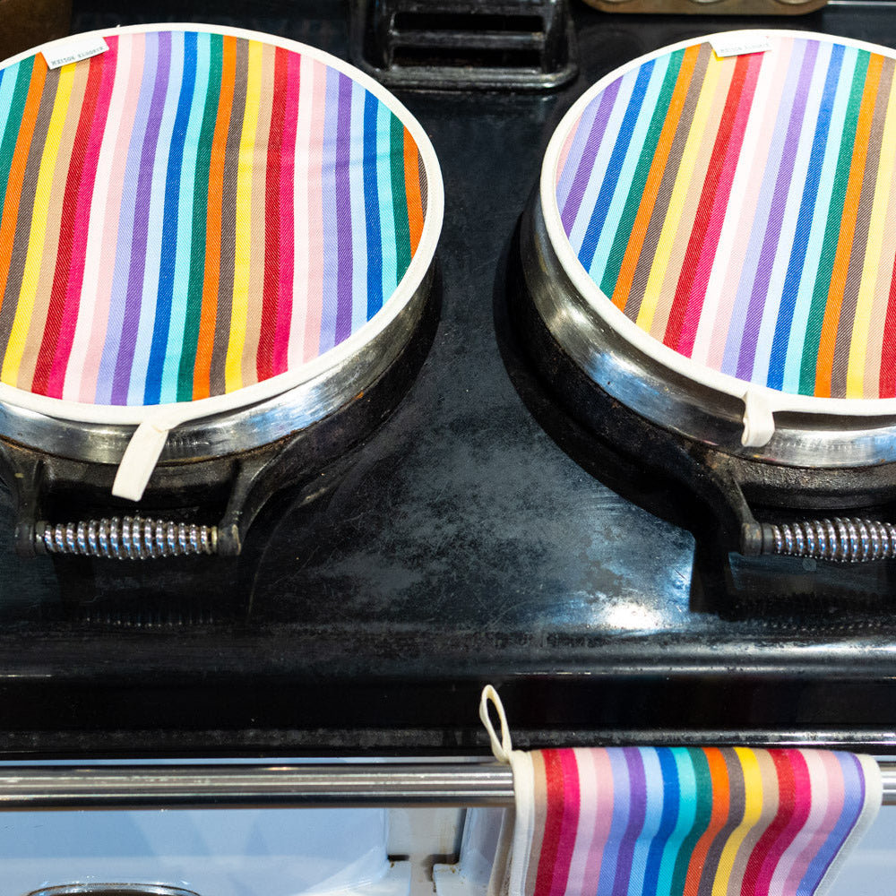 a pair of Aga chef pads rainbow close up