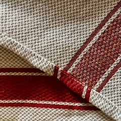 red striped linen fabric showing reversable side and bright side