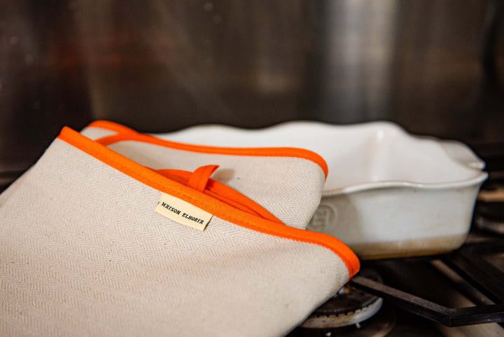 portrait image oven cloth with orange bias close up
