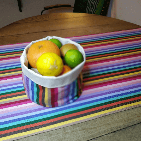 Table runner rainbow with a pot bag matching rainbow with fruits on it