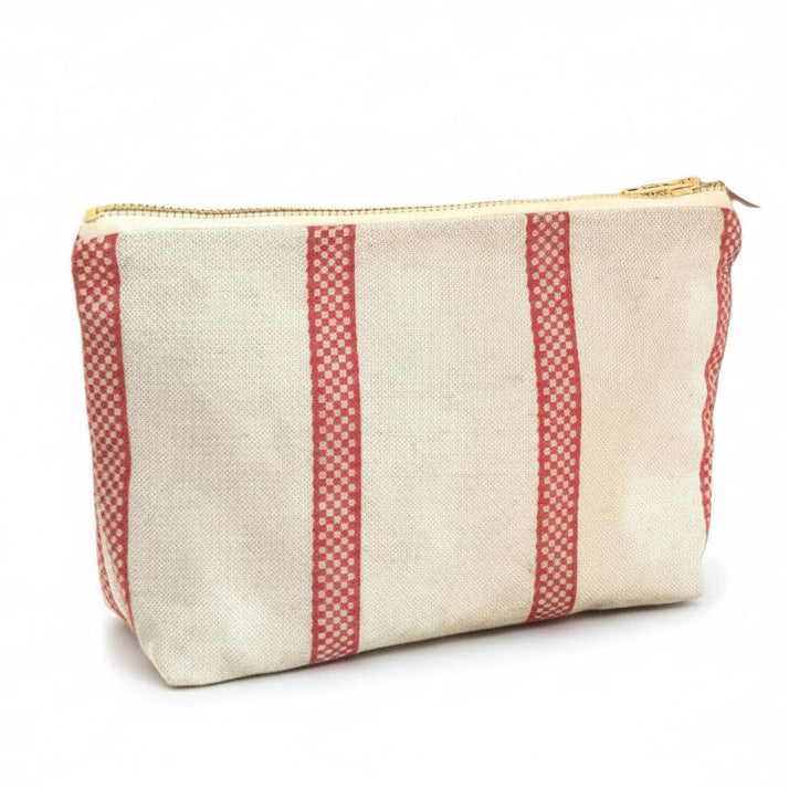 Cut image of a small toiletry bag linen union with red stripes